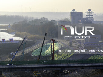 Workers are working at the construction site of the Yundong Gate rescue and reinforcement project east of the intersection of the Subei Irri...