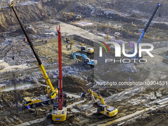 Workers are working at the construction site of the Yundong Gate rescue and reinforcement project east of the intersection of the Subei Irri...