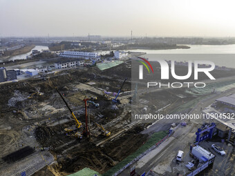 Workers are working at the construction site of the Yundong Gate rescue and reinforcement project east of the intersection of the Subei Irri...