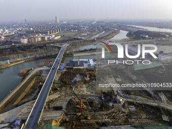 Workers are working at the construction site of the Yundong Gate rescue and reinforcement project east of the intersection of the Subei Irri...