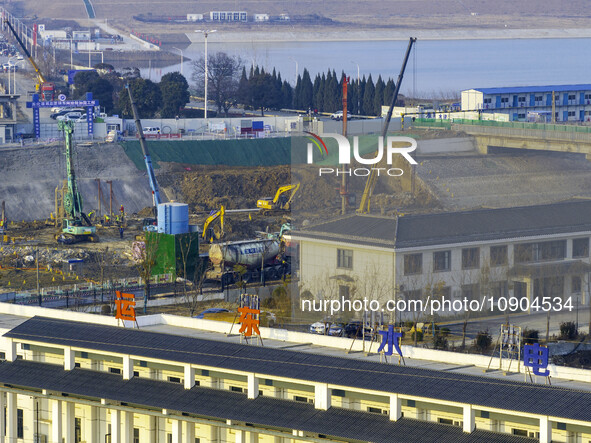 Workers are working at the construction site of the Yundong Gate rescue and reinforcement project east of the intersection of the Subei Irri...