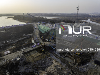 Workers are working at the construction site of the Yundong Gate rescue and reinforcement project east of the intersection of the Subei Irri...