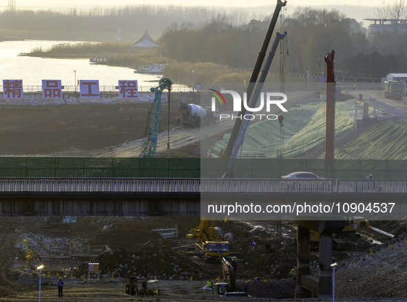 Workers are working at the construction site of the Yundong Gate rescue and reinforcement project east of the intersection of the Subei Irri...