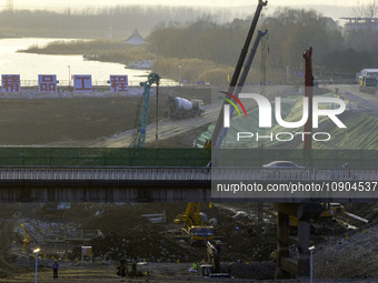 Workers are working at the construction site of the Yundong Gate rescue and reinforcement project east of the intersection of the Subei Irri...