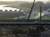 Workers are working at the construction site of the Yundong Gate rescue and reinforcement project east of the intersection of the Subei Irri...