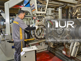 A worker is working on the production line of a tire manufacturing company in the Qingzhou Economic Development Zone, in Qingzhou, China, on...