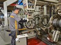 A worker is working on the production line of a tire manufacturing company in the Qingzhou Economic Development Zone, in Qingzhou, China, on...