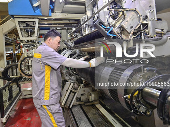 A worker is working on the production line of a tire manufacturing company in the Qingzhou Economic Development Zone, in Qingzhou, China, on...