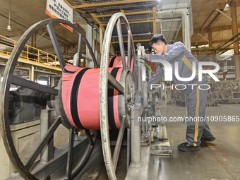 A worker is working on the production line of a tire manufacturing company in the Qingzhou Economic Development Zone, in Qingzhou, China, on...