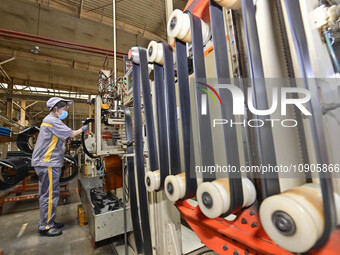 A worker is working on the production line of a tire manufacturing company in the Qingzhou Economic Development Zone, in Qingzhou, China, on...