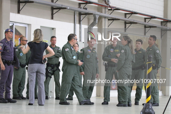 Military police are moving in the hangar of the air group in Sao Paulo, Brazil, on January 12, 2024, after finding the helicopter that went...