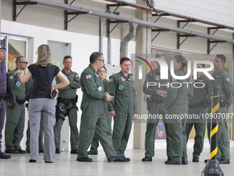 Military police are moving in the hangar of the air group in Sao Paulo, Brazil, on January 12, 2024, after finding the helicopter that went...