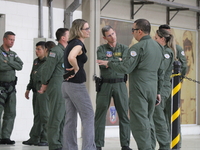 Military police are moving in the hangar of the air group in Sao Paulo, Brazil, on January 12, 2024, after finding the helicopter that went...