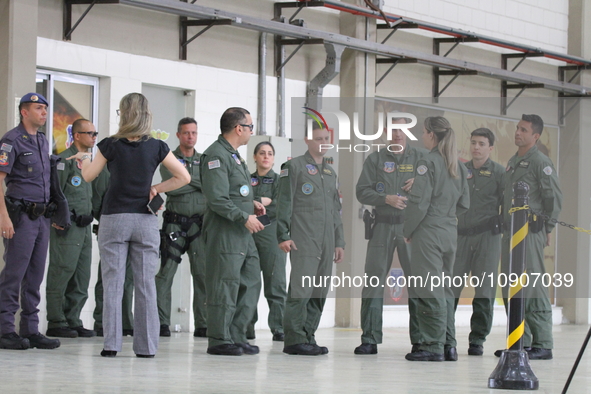 Military police are moving in the hangar of the air group in Sao Paulo, Brazil, on January 12, 2024, after finding the helicopter that went...