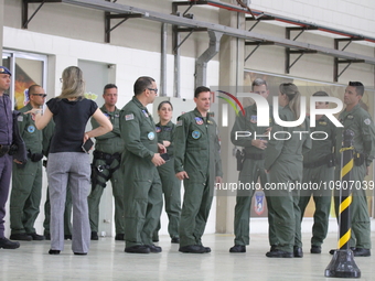 Military police are moving in the hangar of the air group in Sao Paulo, Brazil, on January 12, 2024, after finding the helicopter that went...