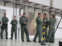 Military police are moving in the hangar of the air group in Sao Paulo, Brazil, on January 12, 2024, after finding the helicopter that went...