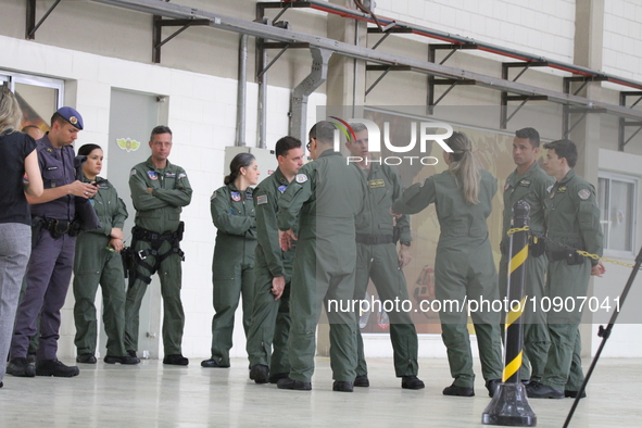 Military police are moving in the hangar of the air group in Sao Paulo, Brazil, on January 12, 2024, after finding the helicopter that went...