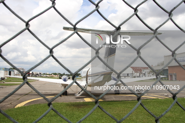 Military police are moving in the hangar of the air group in Sao Paulo, Brazil, on January 12, 2024, after finding the helicopter that went...