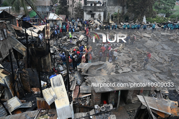 Slum-dwellers in Bangladesh were seen searching for their household belongings after a devastating fire broke out at the Karwan Bazar slum i...