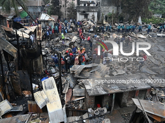 Slum-dwellers in Bangladesh were seen searching for their household belongings after a devastating fire broke out at the Karwan Bazar slum i...