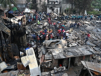 Slum-dwellers in Bangladesh were seen searching for their household belongings after a devastating fire broke out at the Karwan Bazar slum i...