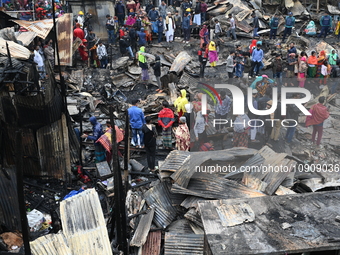 Slum-dwellers in Bangladesh were seen searching for their household belongings after a devastating fire broke out at the Karwan Bazar slum i...