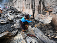 Slum-dwellers in Bangladesh were seen searching for their household belongings after a devastating fire broke out at the Karwan Bazar slum i...