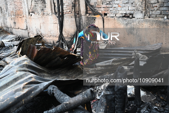 Slum-dwellers in Bangladesh were seen searching for their household belongings after a devastating fire broke out at the Karwan Bazar slum i...