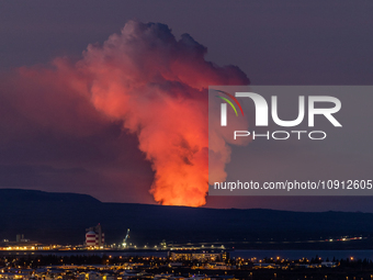 A volcano is spewing lava and smoke as it erupts in Reykjanes Peninsula, Iceland, on January 14, 2024. The volcanic eruption, which occurred...