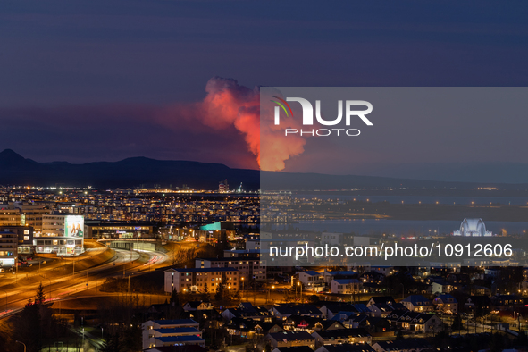 A volcano is spewing lava and smoke as it erupts in Reykjanes Peninsula, Iceland, on January 14, 2024. The volcanic eruption, which occurred...