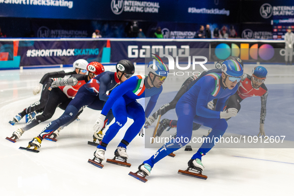 Peter Riches, Mattia Antonioli, and Thomas Nadalini are competing in the 5000m relay men's event on the third day of the European Short Trac...