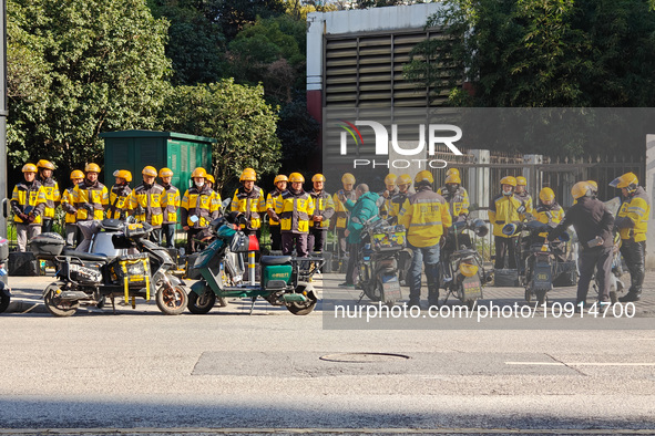 Many Meituan food delivery workers are lining up to make preparations in Shanghai, China, on January 14, 2024. 