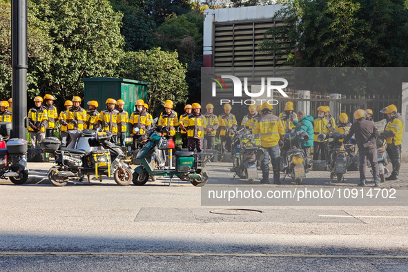 Many Meituan food delivery workers are lining up to make preparations in Shanghai, China, on January 14, 2024. 