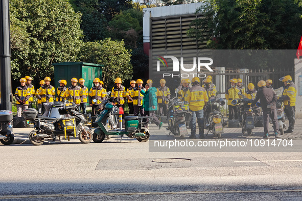 Many Meituan food delivery workers are lining up to make preparations in Shanghai, China, on January 14, 2024. 