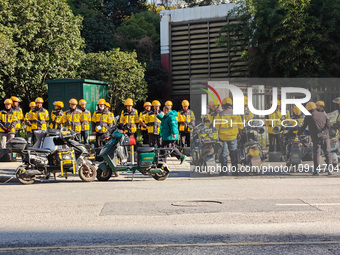 Many Meituan food delivery workers are lining up to make preparations in Shanghai, China, on January 14, 2024. (