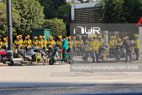 Many Meituan food delivery workers are lining up to make preparations in Shanghai, China, on January 14, 2024. 