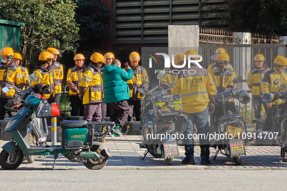 Many Meituan food delivery workers are lining up to make preparations in Shanghai, China, on January 14, 2024. 