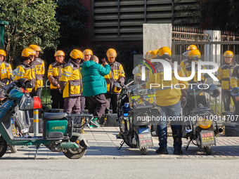 Many Meituan food delivery workers are lining up to make preparations in Shanghai, China, on January 14, 2024. (