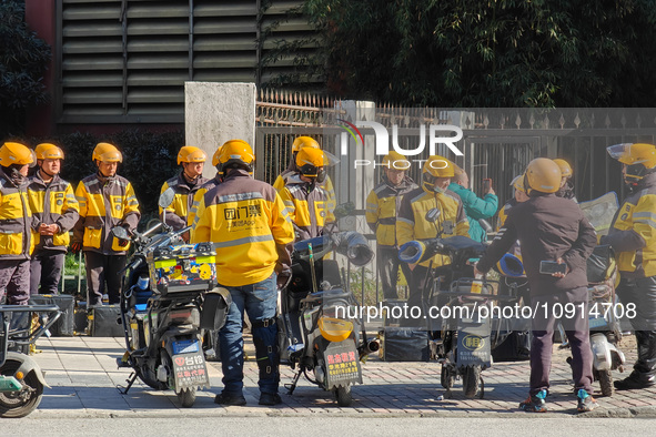 Many Meituan food delivery workers are lining up to make preparations in Shanghai, China, on January 14, 2024. 