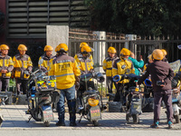 Many Meituan food delivery workers are lining up to make preparations in Shanghai, China, on January 14, 2024. (