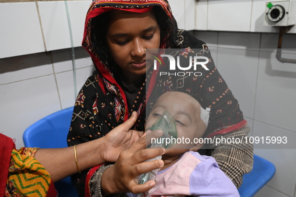 A baby is receiving treatment for pneumonia inside Dhaka Child Hospital during the winter season in Dhaka, Bangladesh, on January 15, 2024. 