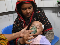 A baby is receiving treatment for pneumonia inside Dhaka Child Hospital during the winter season in Dhaka, Bangladesh, on January 15, 2024....