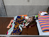 A baby is receiving treatment for pneumonia inside Dhaka Child Hospital during the winter season in Dhaka, Bangladesh, on January 15, 2024....