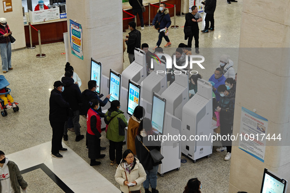 Patients are making appointments, paying fees, and collecting medicine at a hospital in Shanghai, China, on January 16, 2024. 