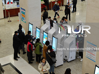 Patients are making appointments, paying fees, and collecting medicine at a hospital in Shanghai, China, on January 16, 2024. (