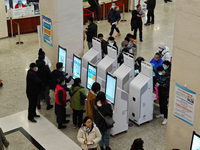 Patients are making appointments, paying fees, and collecting medicine at a hospital in Shanghai, China, on January 16, 2024. (