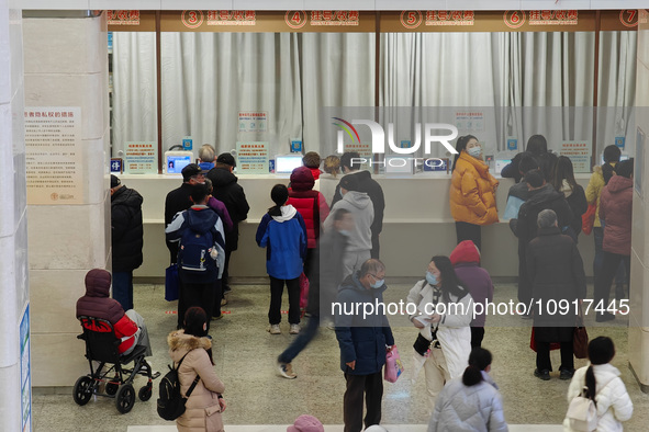 Patients are making appointments, paying fees, and collecting medicine at a hospital in Shanghai, China, on January 16, 2024. 