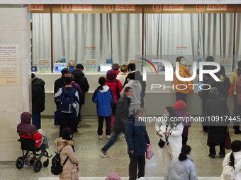 Patients are making appointments, paying fees, and collecting medicine at a hospital in Shanghai, China, on January 16, 2024. (