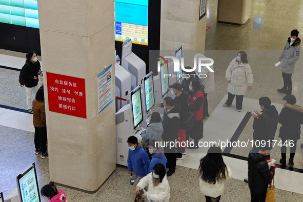 Patients are making appointments, paying fees, and collecting medicine at a hospital in Shanghai, China, on January 16, 2024. 