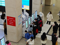 Patients are making appointments, paying fees, and collecting medicine at a hospital in Shanghai, China, on January 16, 2024. (